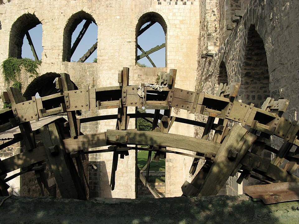 The Orontes norias at Hama, photographed in 2008 by Vyacheslav Argenberg; the machines witness a much longer Syrian engineering history.